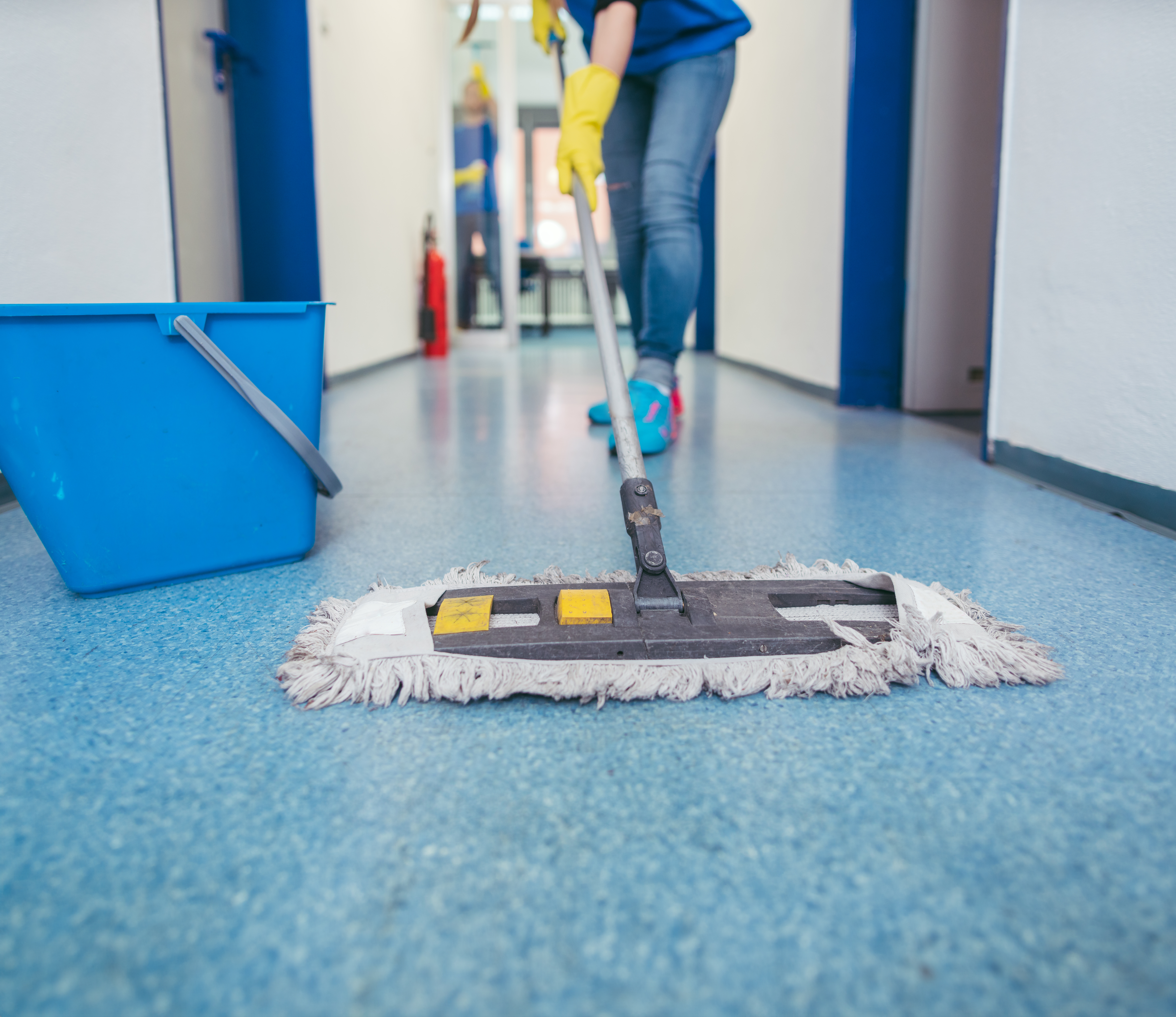 Person cleaning floor